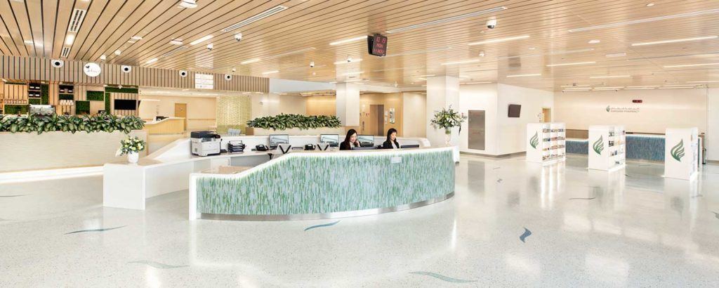 As built and photographed in the main reception — same curve, same detail, in real daylight.